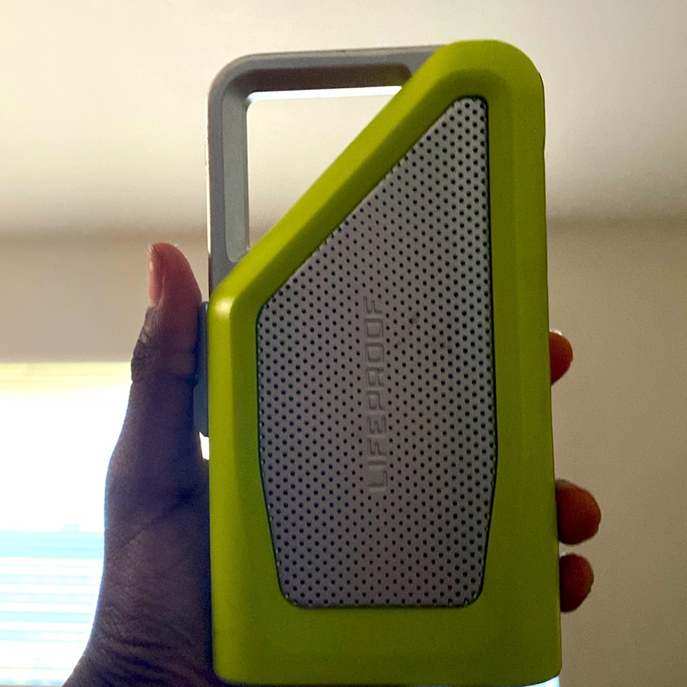 Green and silver lifeproof speaker is waterproof